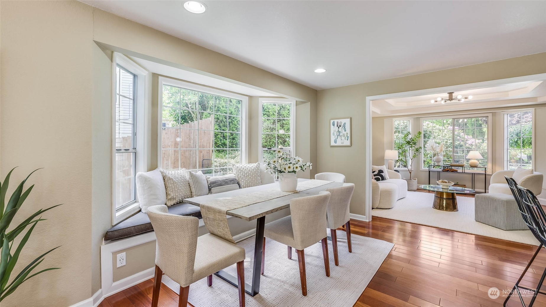 16844 119th Place Northeast Bothell, WA 98011 - Photo 4 of 26 a view of a dining room with furniture large windows and wooden floor