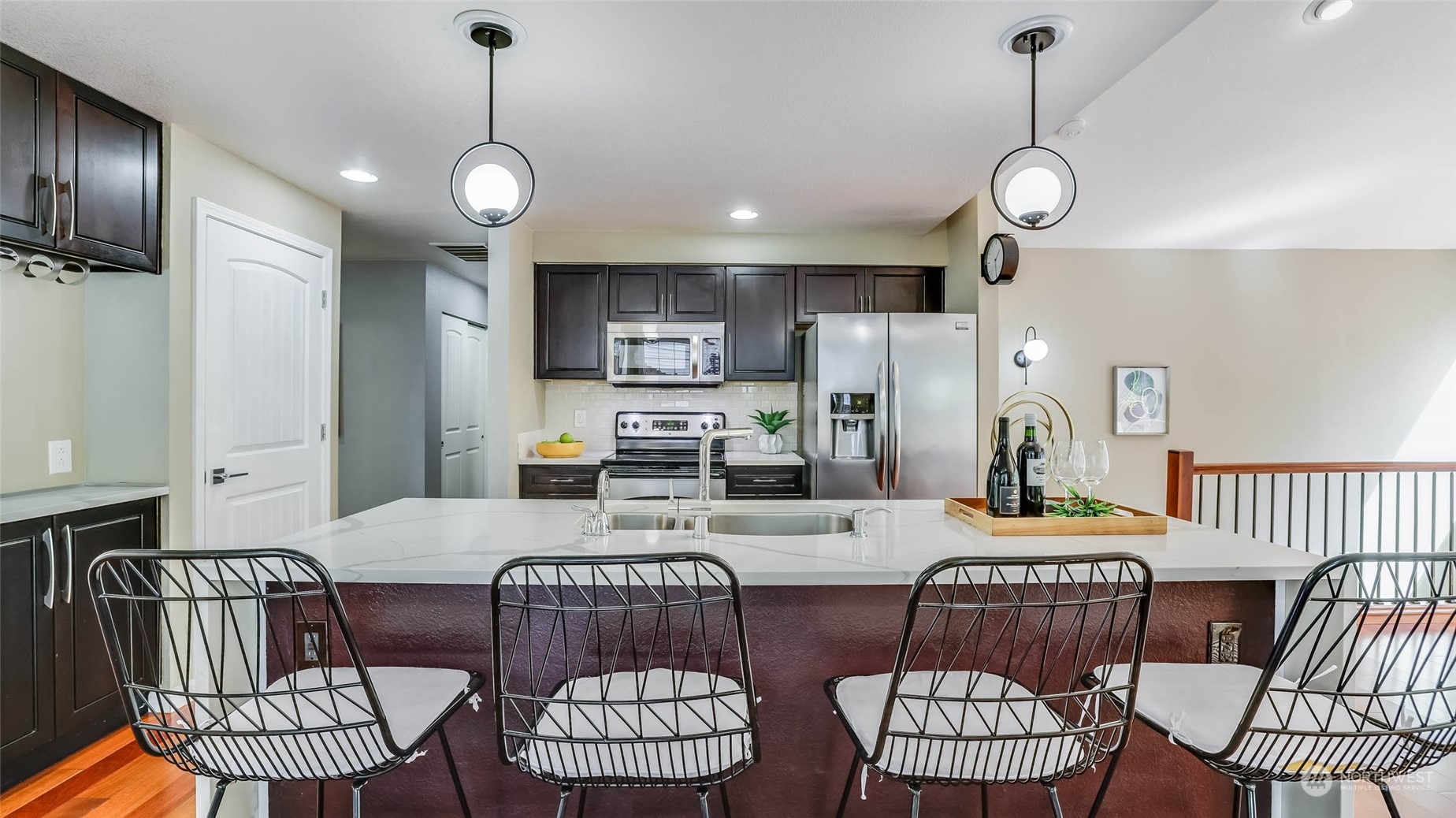 16844 119th Place Northeast Bothell, WA 98011 - Photo 6 of 26 a living room with furniture kitchen view and a chandelier