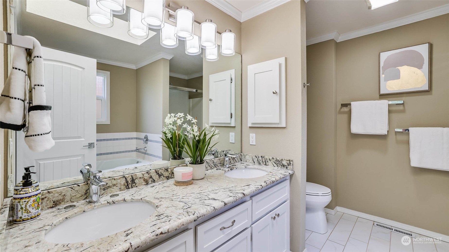 16844 119th Place Northeast Bothell, WA 98011 - Photo 9 of 26 a bathroom with a granite countertop sink a toilet and a mirror