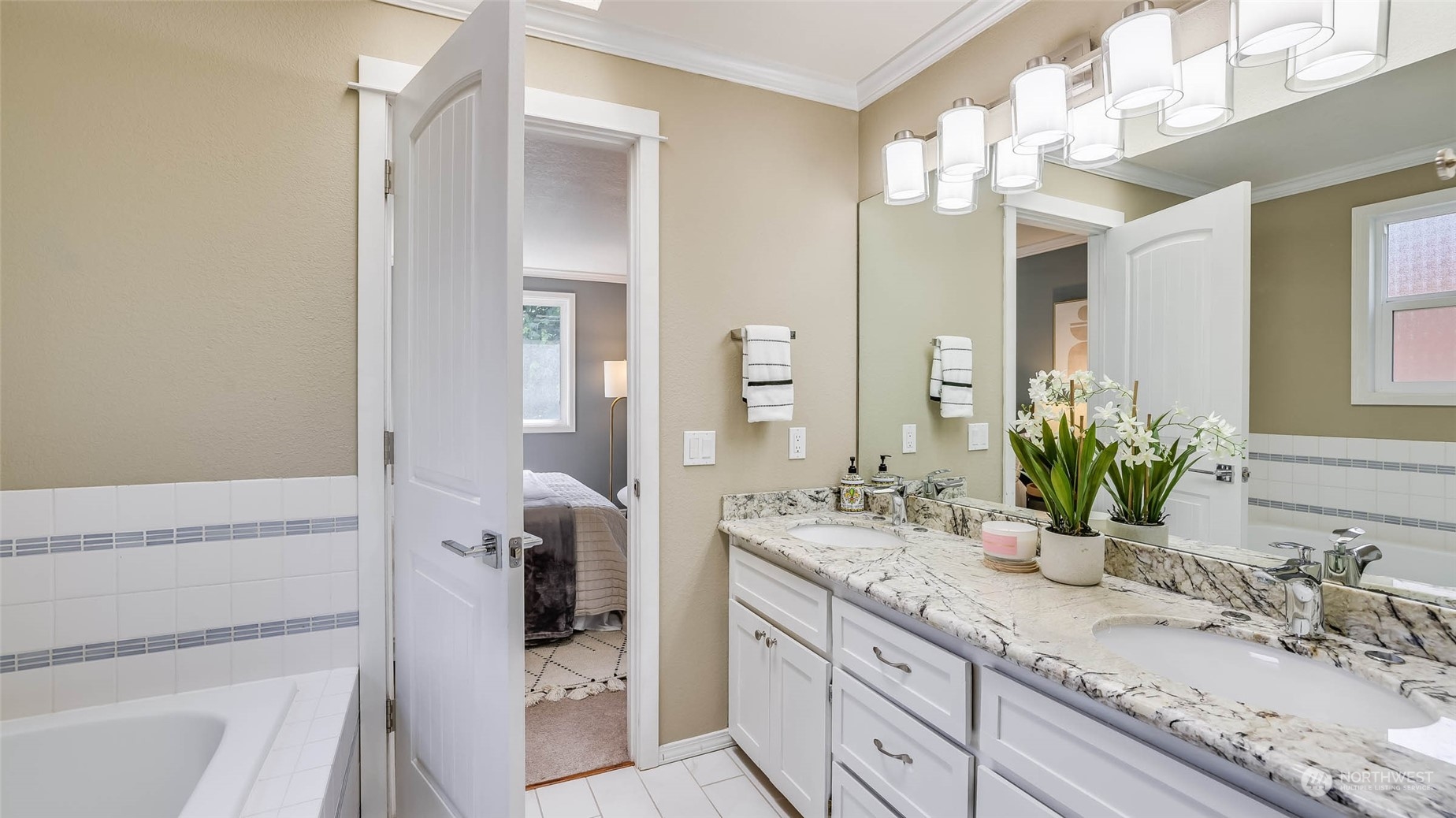 16844 119th Place Northeast Bothell, WA 98011 - Photo 10 of 26 a bathroom with a double vanity sink and a mirror