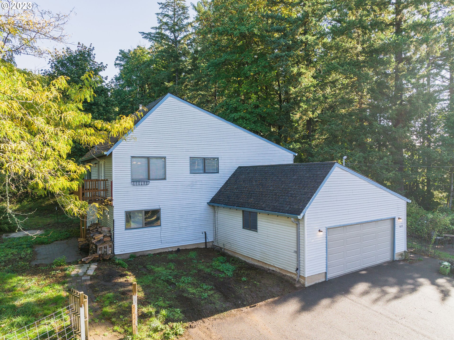 34609 Southeast Hurlburt Road Corbett, OR 97019 - Photo 1 of 48 a front view of a house with a yard