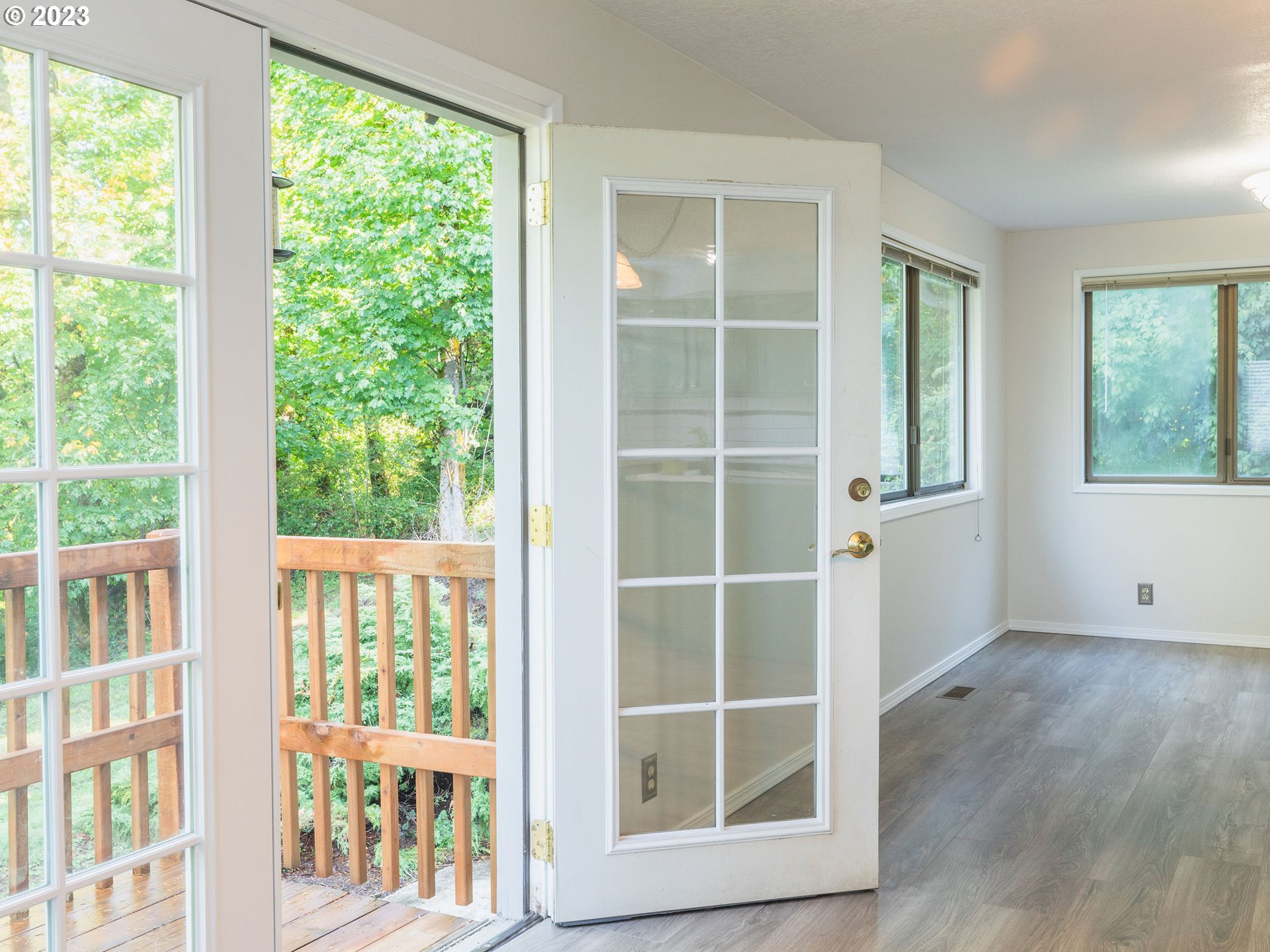 34609 Southeast Hurlburt Road Corbett, OR 97019 - Photo 17 of 48 a view of empty room with wooden floor and windows