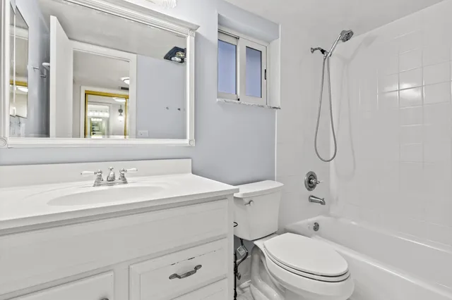 a bathroom with a sink a toilet and a bathtub