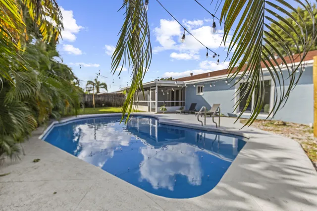 a view of a swimming pool with a patio