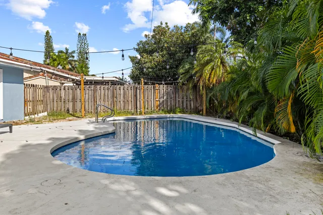 a view of a swimming pool with a patio