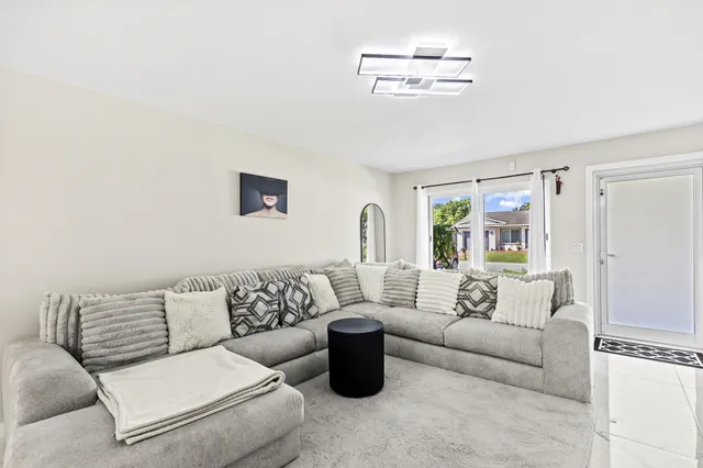 a living room with furniture and a couch