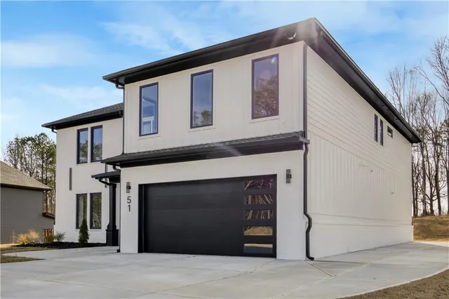 a front view of a house with a garage