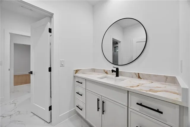 a bathroom with a toilet a sink and shower