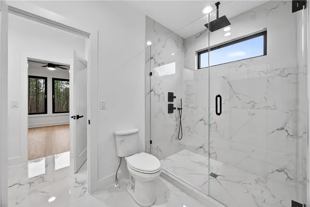 a bathroom with a granite countertop sink mirror and vanity