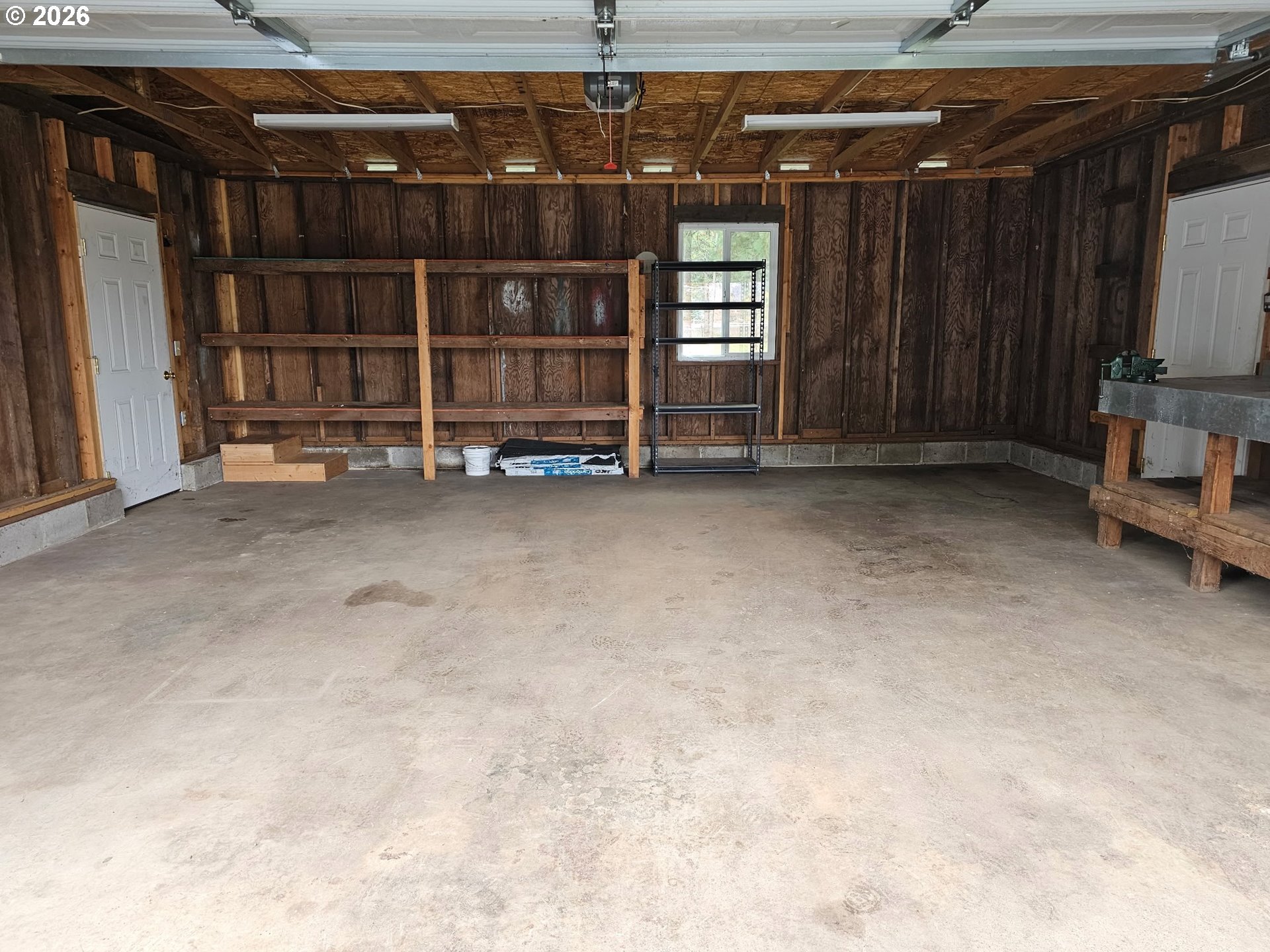 33802 Market Road Creswell, OR 97426 - Photo 17 of 30 a view of an empty room with wooden shelves