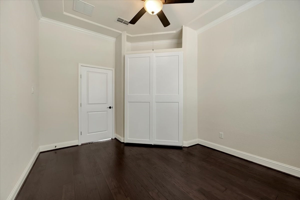 5410 Marble Acres Court Houston, TX 77059 - Photo 12 of 49 an empty room with a hardwood and ceiling fan