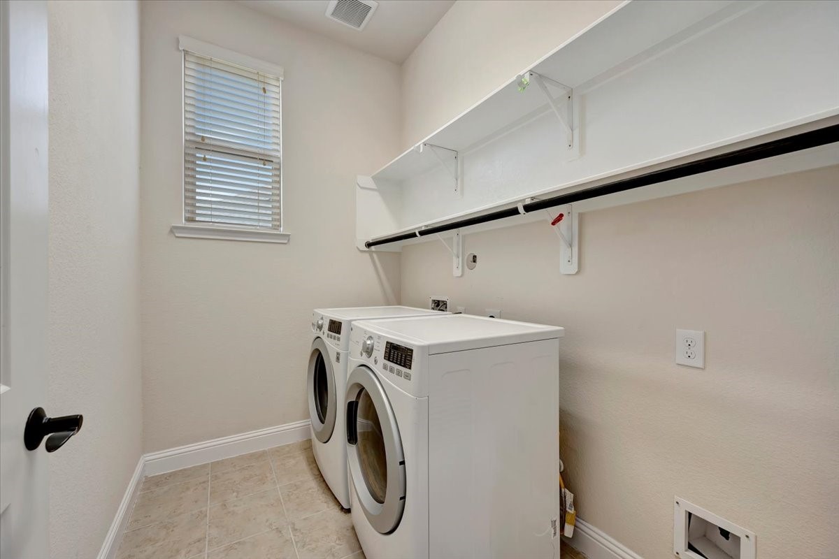 5410 Marble Acres Court Houston, TX 77059 - Photo 14 of 49 a utility room with dryer and washer