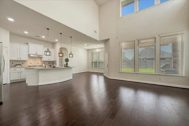 a view of kitchen with cabinets and wooden floor