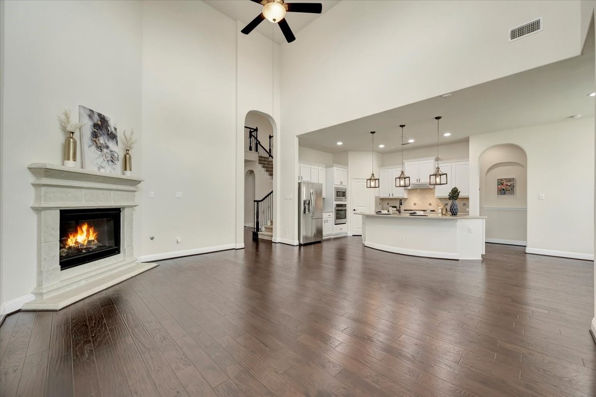 5410 Marble Acres Court Houston, TX 77059 - Photo 20 of 49 a view of open kitchen with furniture and a fireplace