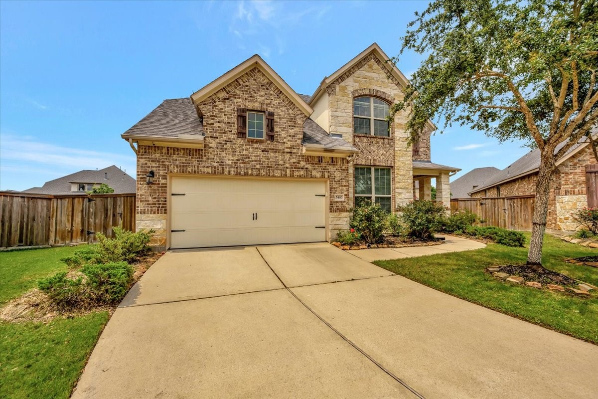 5410 Marble Acres Court Houston, TX 77059 - Photo 3 of 49 a front view of a house with a garden