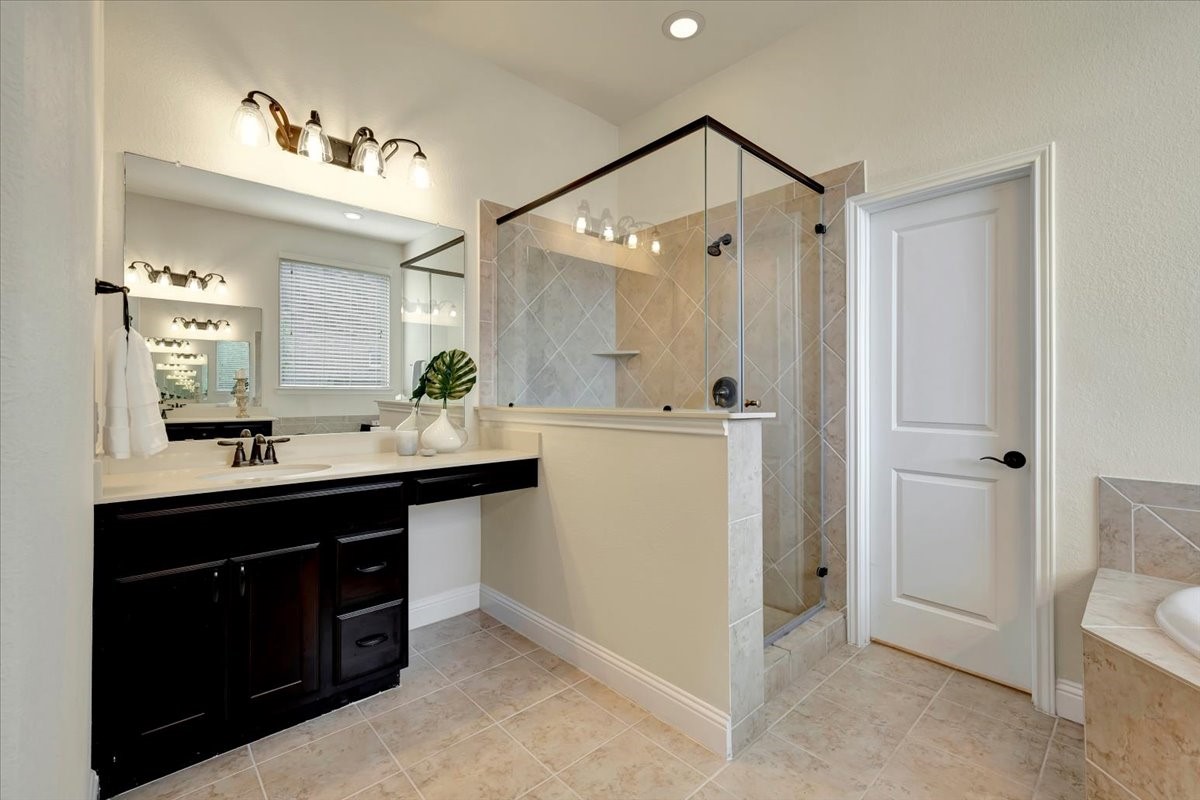 5410 Marble Acres Court Houston, TX 77059 - Photo 32 of 49 a bathroom with a sink vanity and a mirror