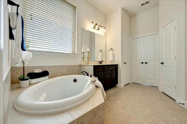 a bathroom with a bathtub and a sink