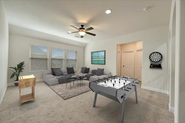 a living room with furniture a table and a chandelier