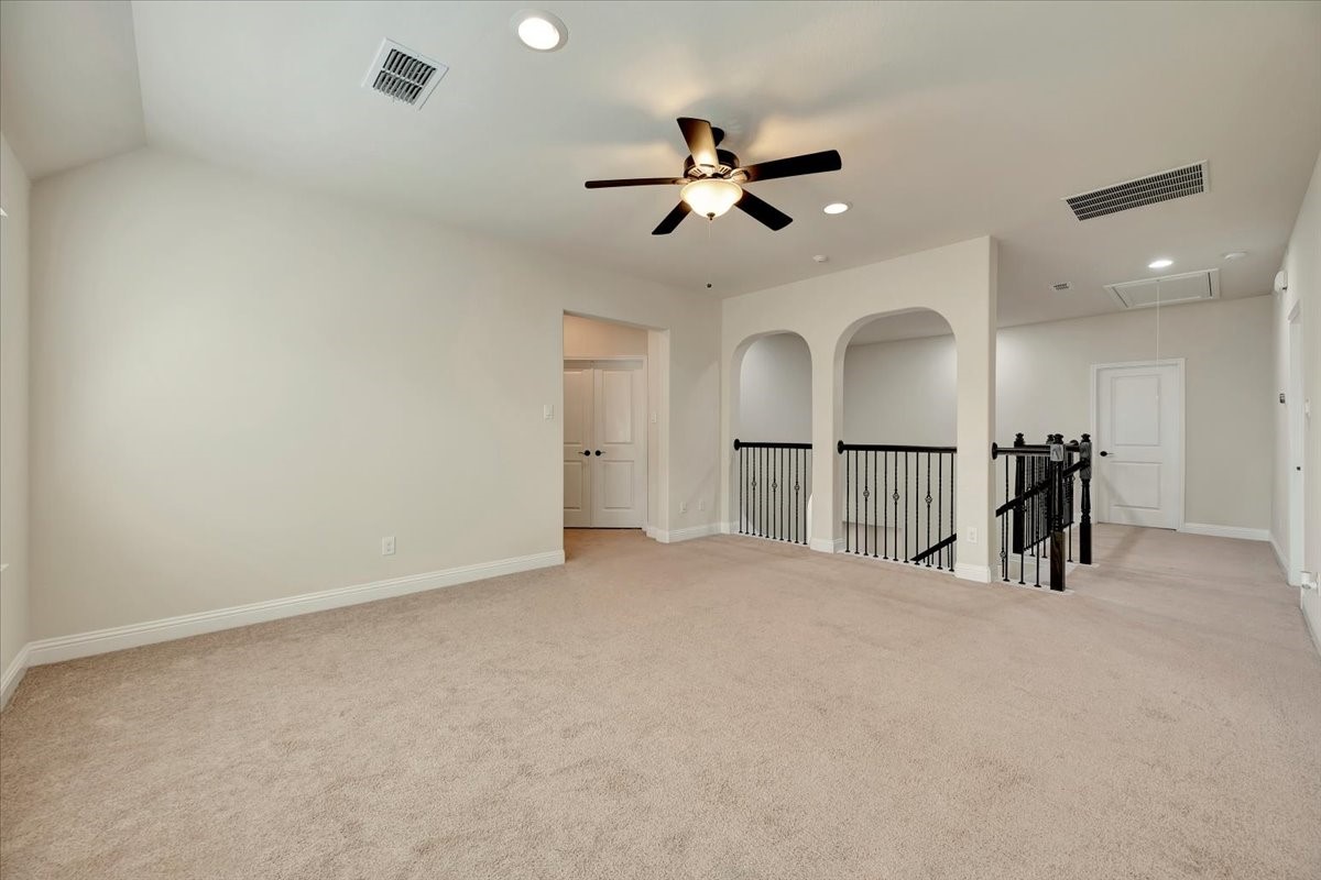 5410 Marble Acres Court Houston, TX 77059 - Photo 36 of 49 a view of an empty room and a chandelier fan