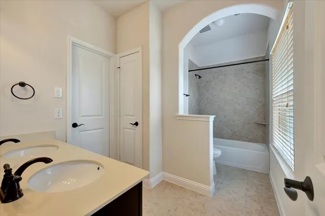 a bathroom with a sink and a bathtub