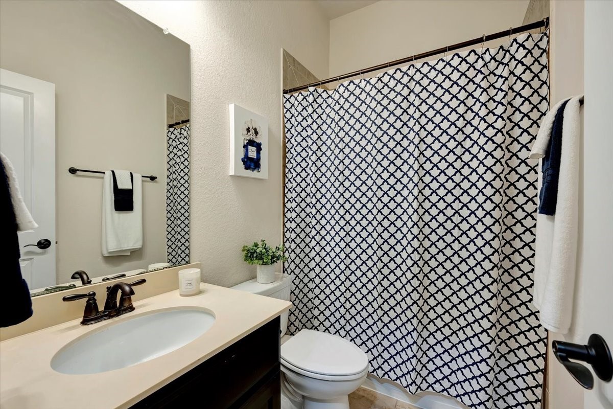 5410 Marble Acres Court Houston, TX 77059 - Photo 46 of 49 a bathroom with a sink and a mirror