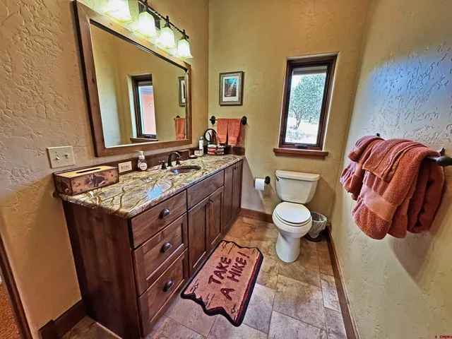 a bathroom with a shower curtain and a sink