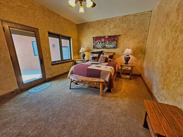 a view of bathroom with a sink a toilet a mirror and shower