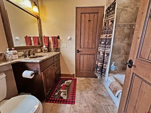 a bathroom with a bathtub and shower