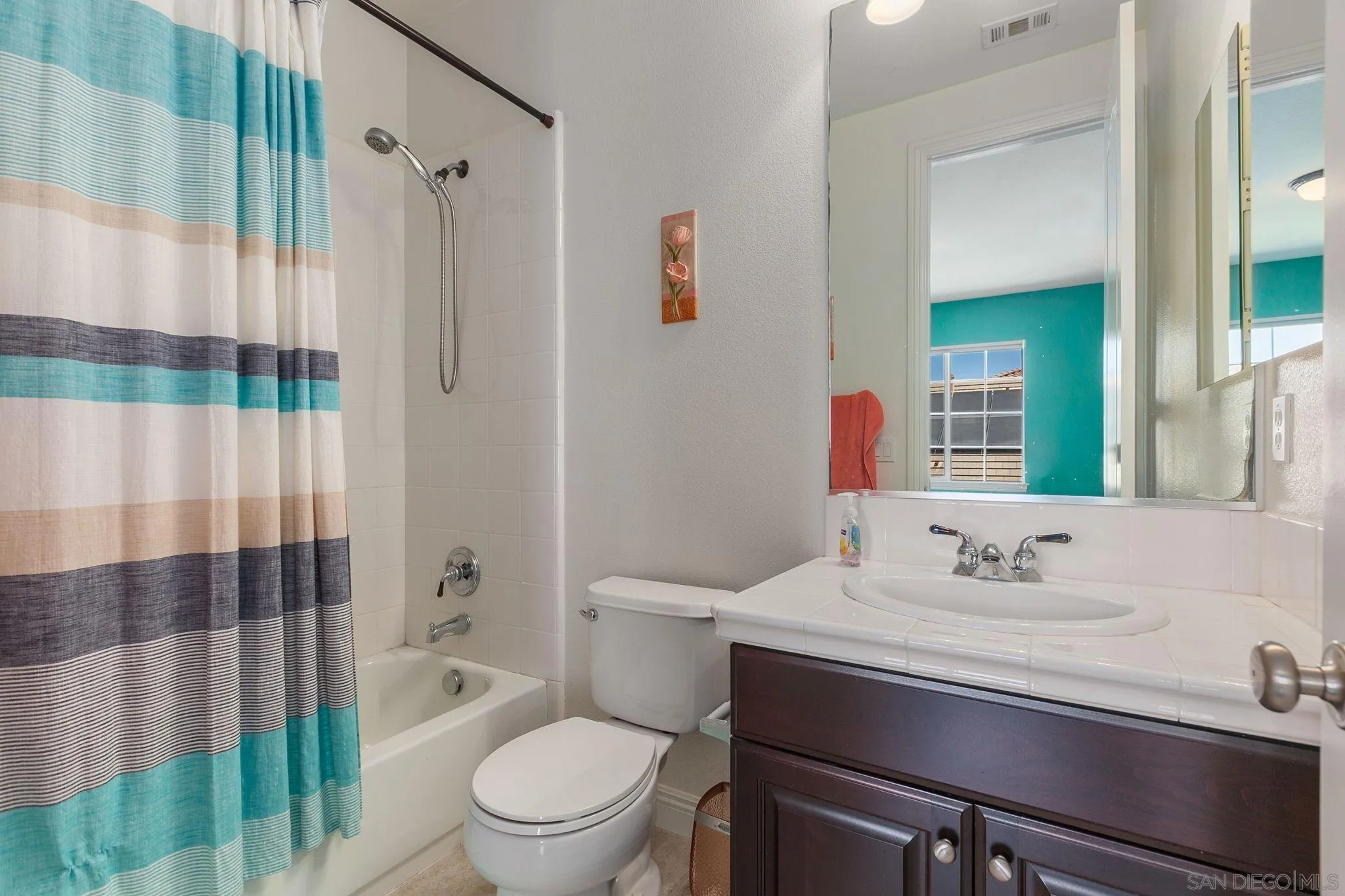 6340 Montecito Drive Carlsbad, CA 92009 - Photo 16 of 23 a bathroom with a sink toilet and shower
