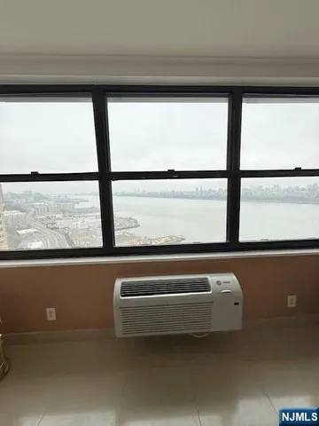 a view of a room with furniture and window