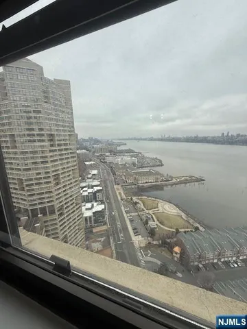 a view of a balcony next to a yard