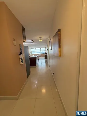 a view of a hallway with seating area