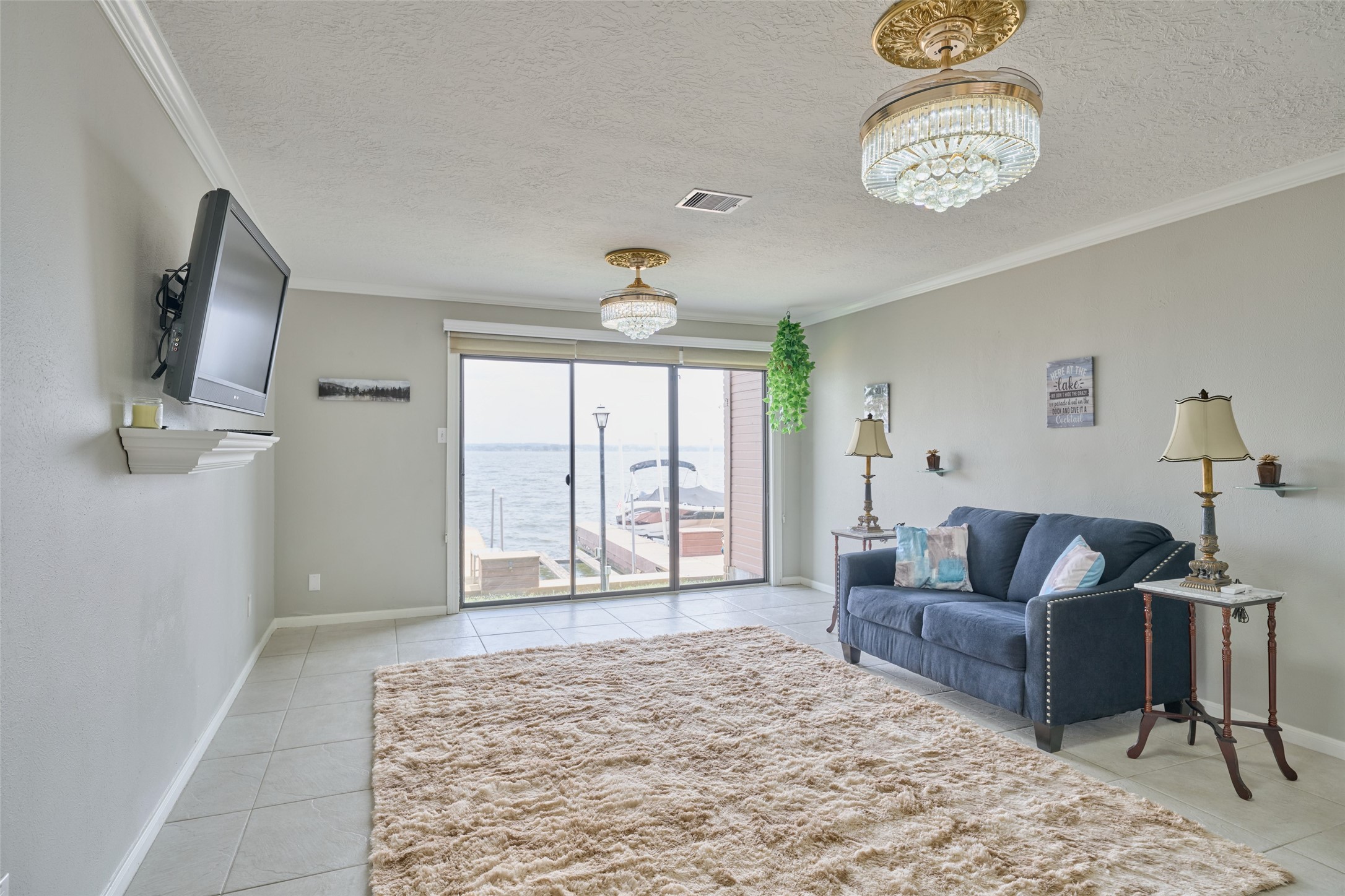 801 River Road, Unit 105D Montgomery, TX 77356 - Photo 7 of 32 Spacious living room. Sliding glass doors across the back open up to amazing views.
