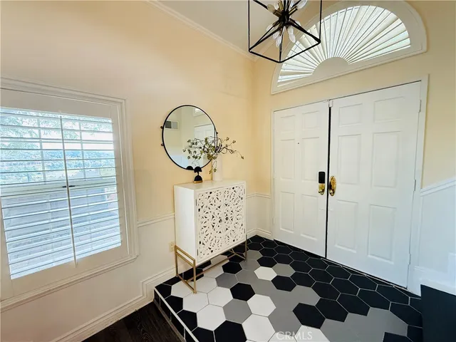 a view of a entryway door with wooden floor