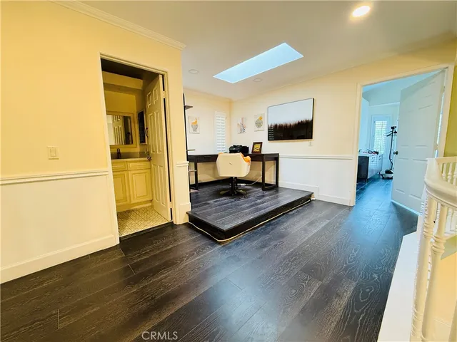 a living room with a flat screen tv and a table