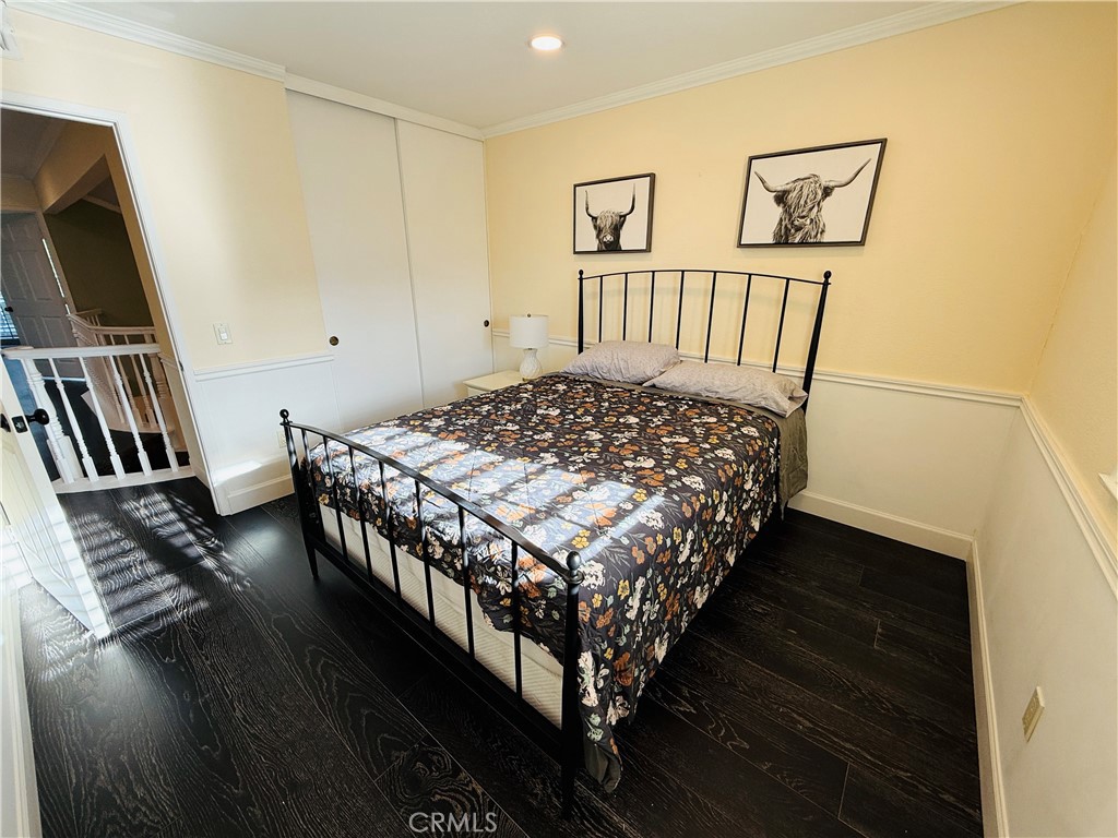 20977 Canyon Ridge Road Diamond Bar, CA 91789 - Photo 20 of 31 a bed sitting in a bedroom next to a window with wooden floor