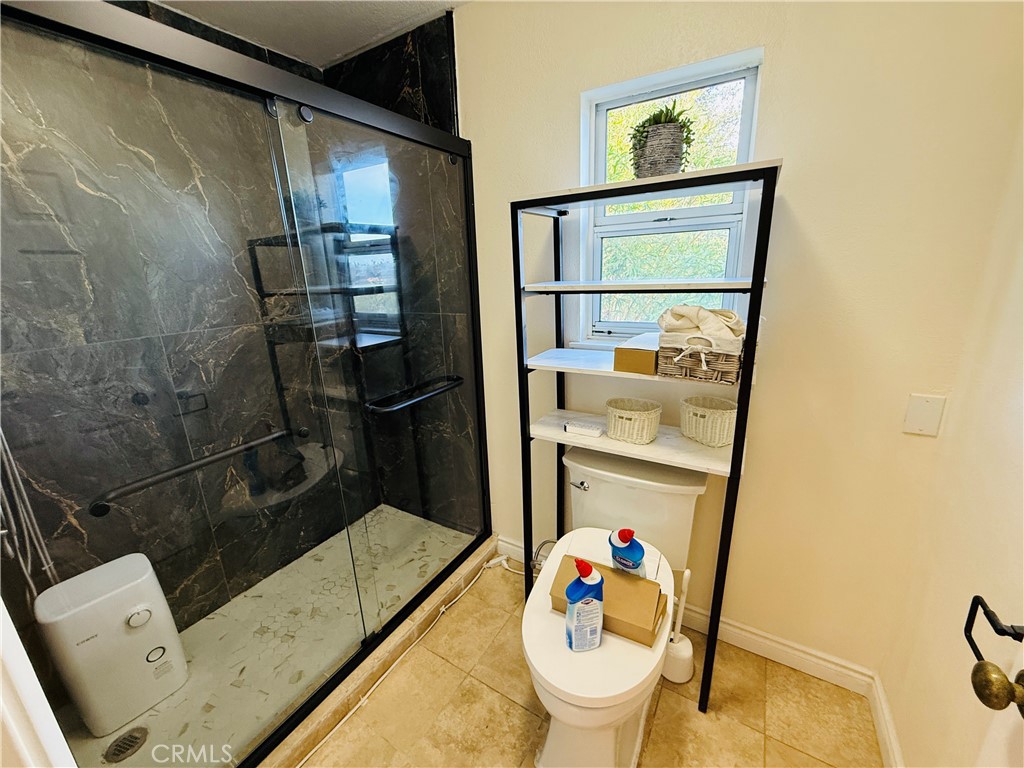 20977 Canyon Ridge Road Diamond Bar, CA 91789 - Photo 24 of 31 a bathroom with a sink mirror toilet and shower