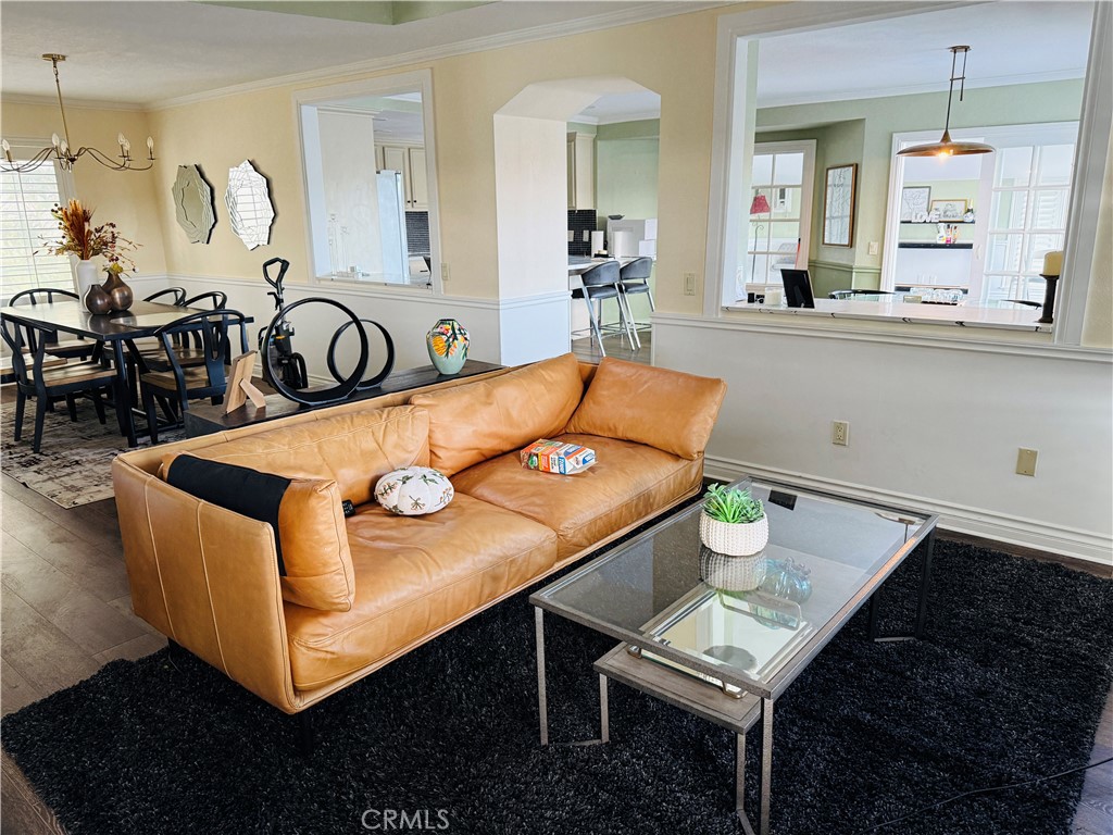 20977 Canyon Ridge Road Diamond Bar, CA 91789 - Photo 27 of 31 a living room with furniture a table and kitchen view