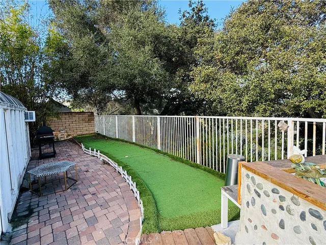 a view of a backyard with a small cabin