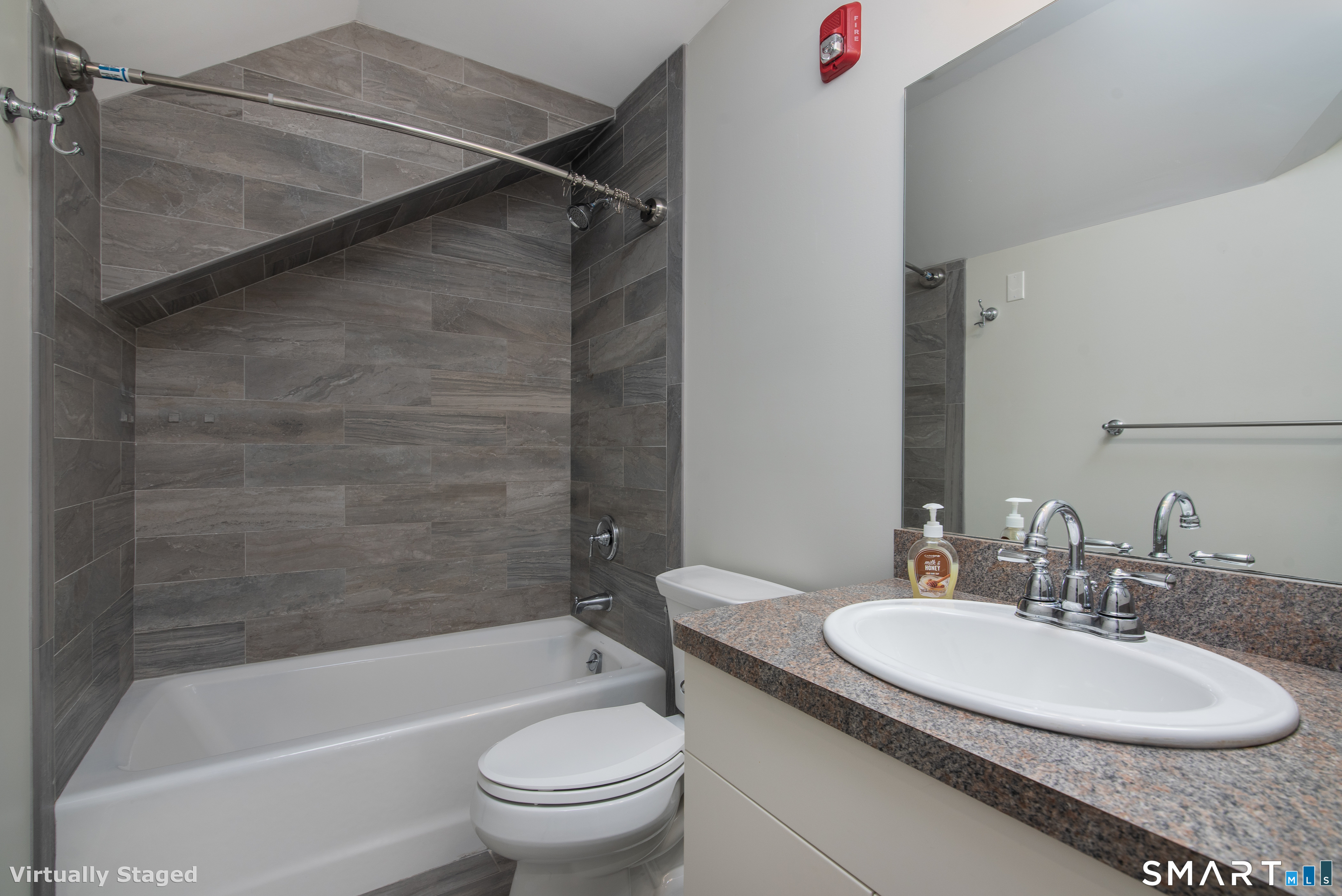 82 Wall Street, Unit 300 Madison, CT 06443 - Photo 6 of 7 a bathroom with a sink toilet and shower
