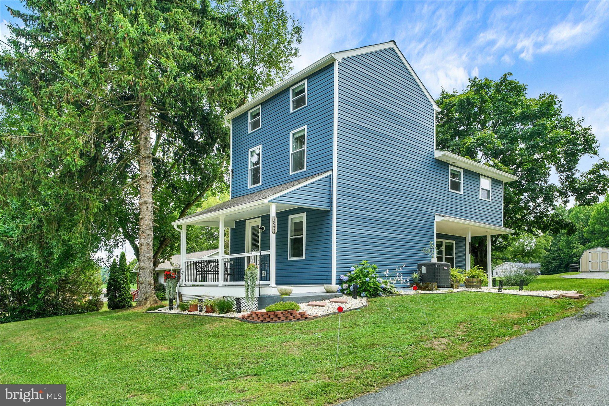 1847 Blue Ball Road Elkton, MD 21921 - Photo 4 of 45 Charming blue home with lush greenery.