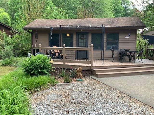 454 Hidden Valley Road, Unit 140 Cleveland, GA 30528 - Photo 1 of 1 a view of a house with backyard and porch