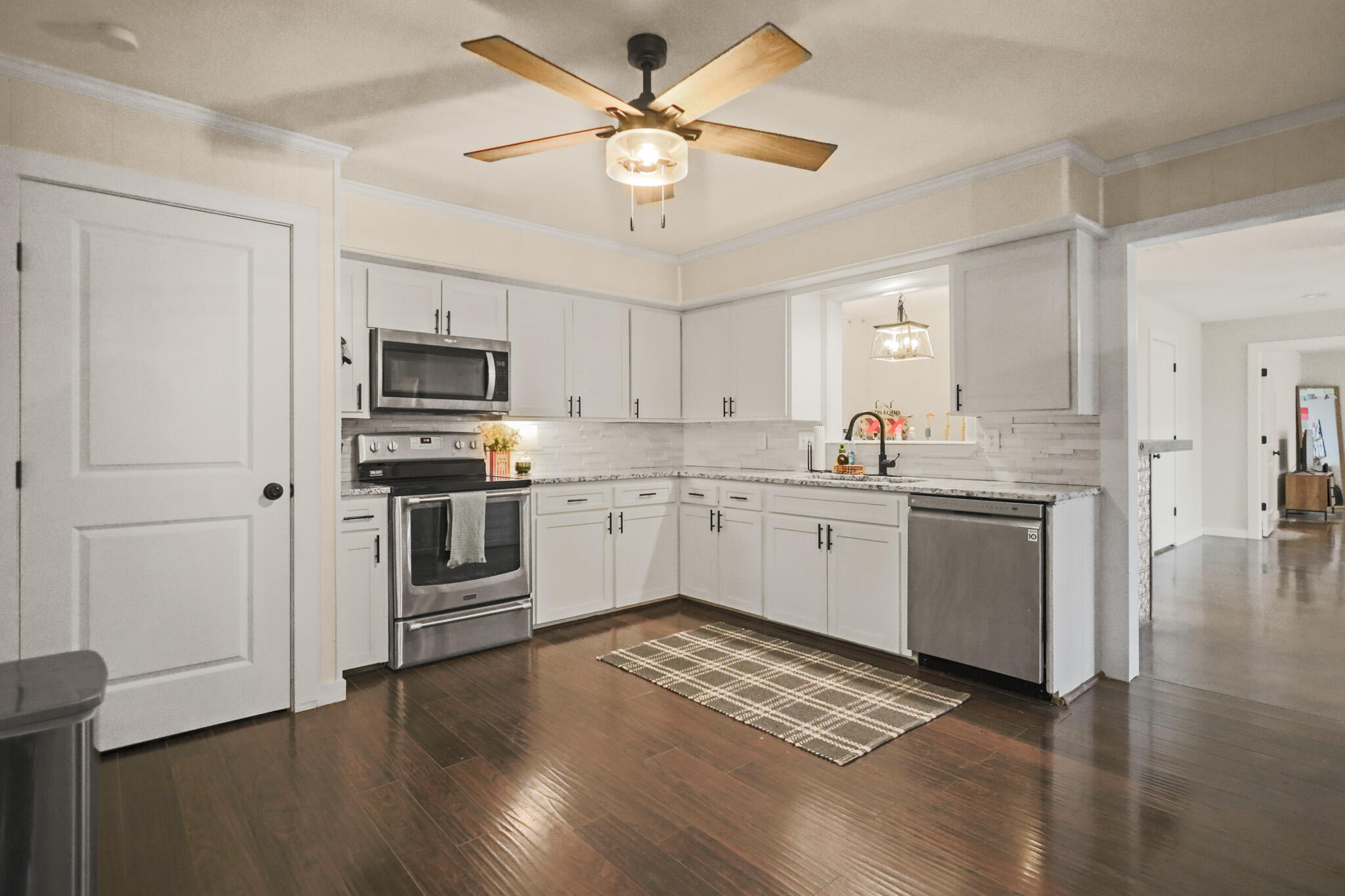 4302 42nd Street Lubbock, TX 79413 - Photo 11 of 67 a kitchen with stove cabinets and refrigerator