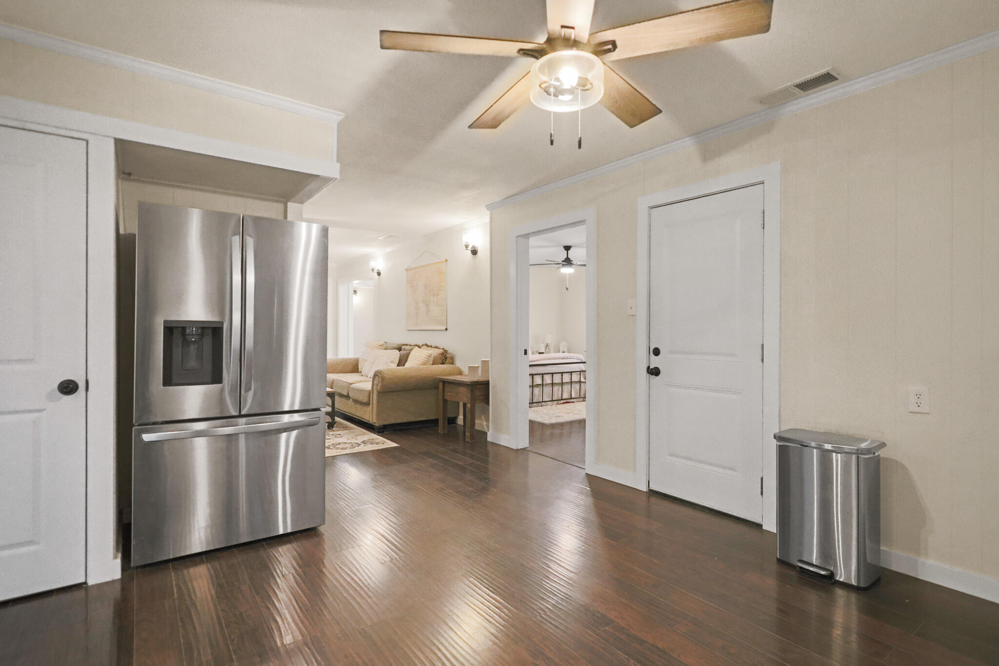 4302 42nd Street Lubbock, TX 79413 - Photo 15 of 67 a kitchen with stainless steel appliances a refrigerator and wooden floor