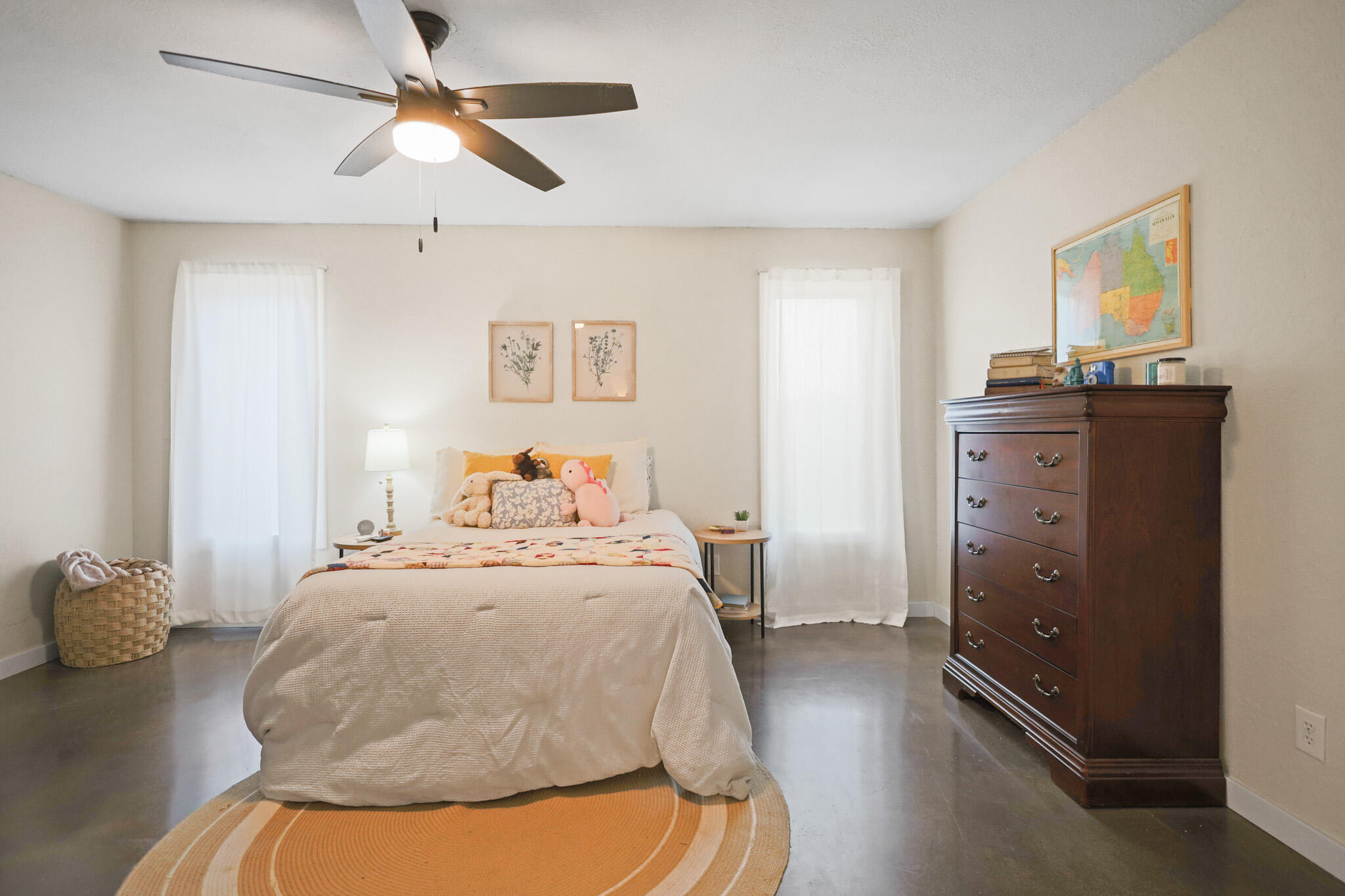 4302 42nd Street Lubbock, TX 79413 - Photo 32 of 67 a bedroom with a bed and a chandelier
