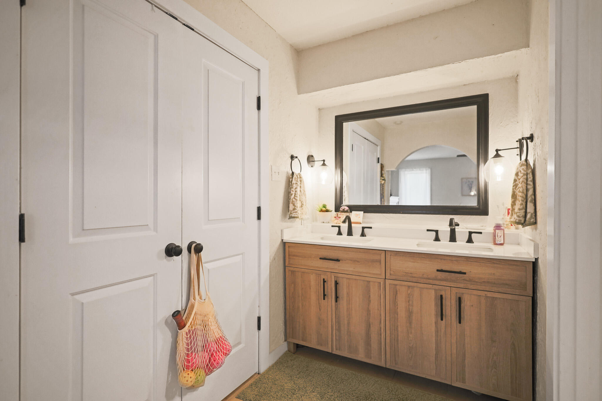 4302 42nd Street Lubbock, TX 79413 - Photo 35 of 67 a bathroom with a toilet sink and mirror