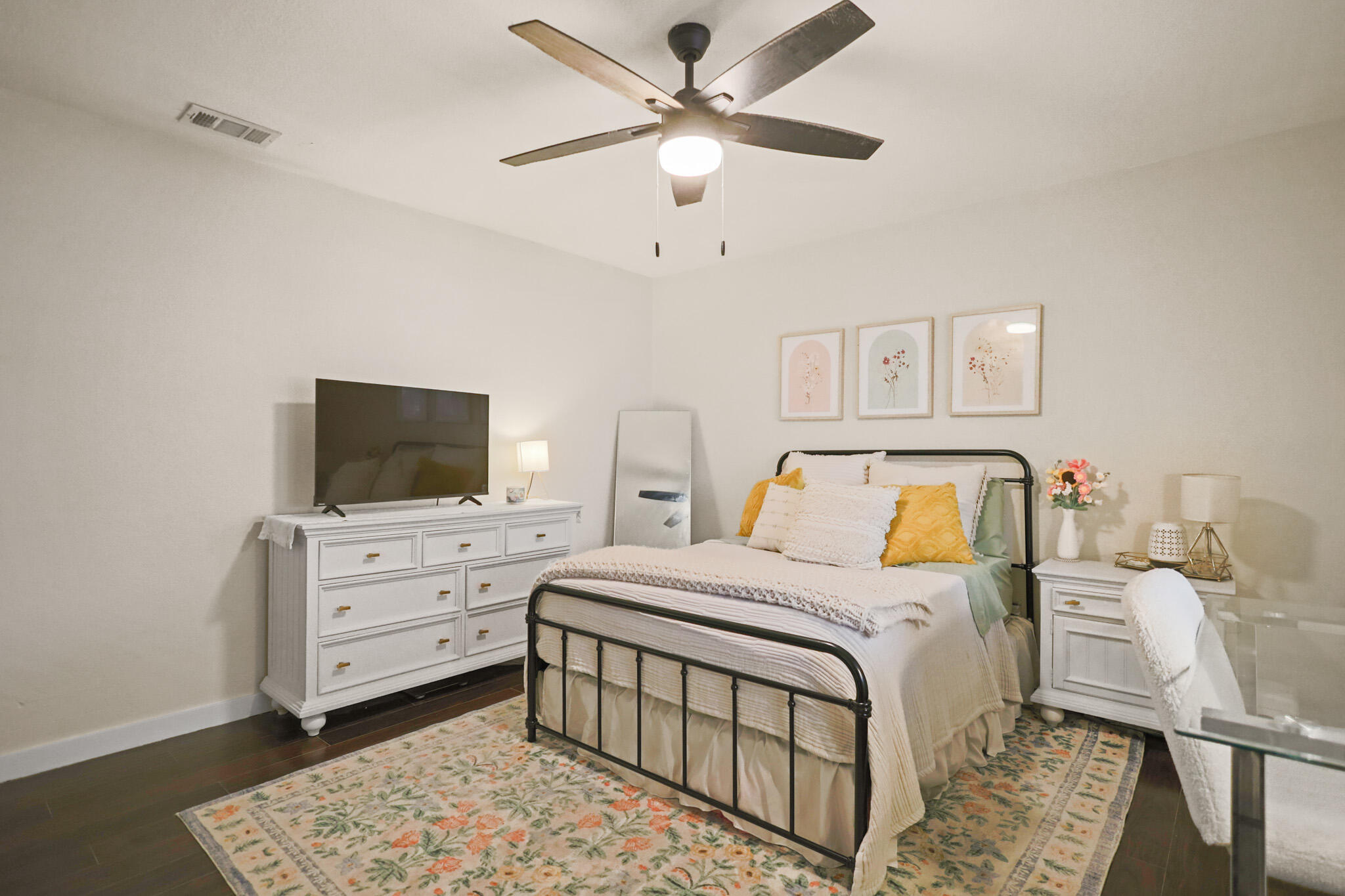 4302 42nd Street Lubbock, TX 79413 - Photo 44 of 67 a bedroom with a bed and a flat screen tv