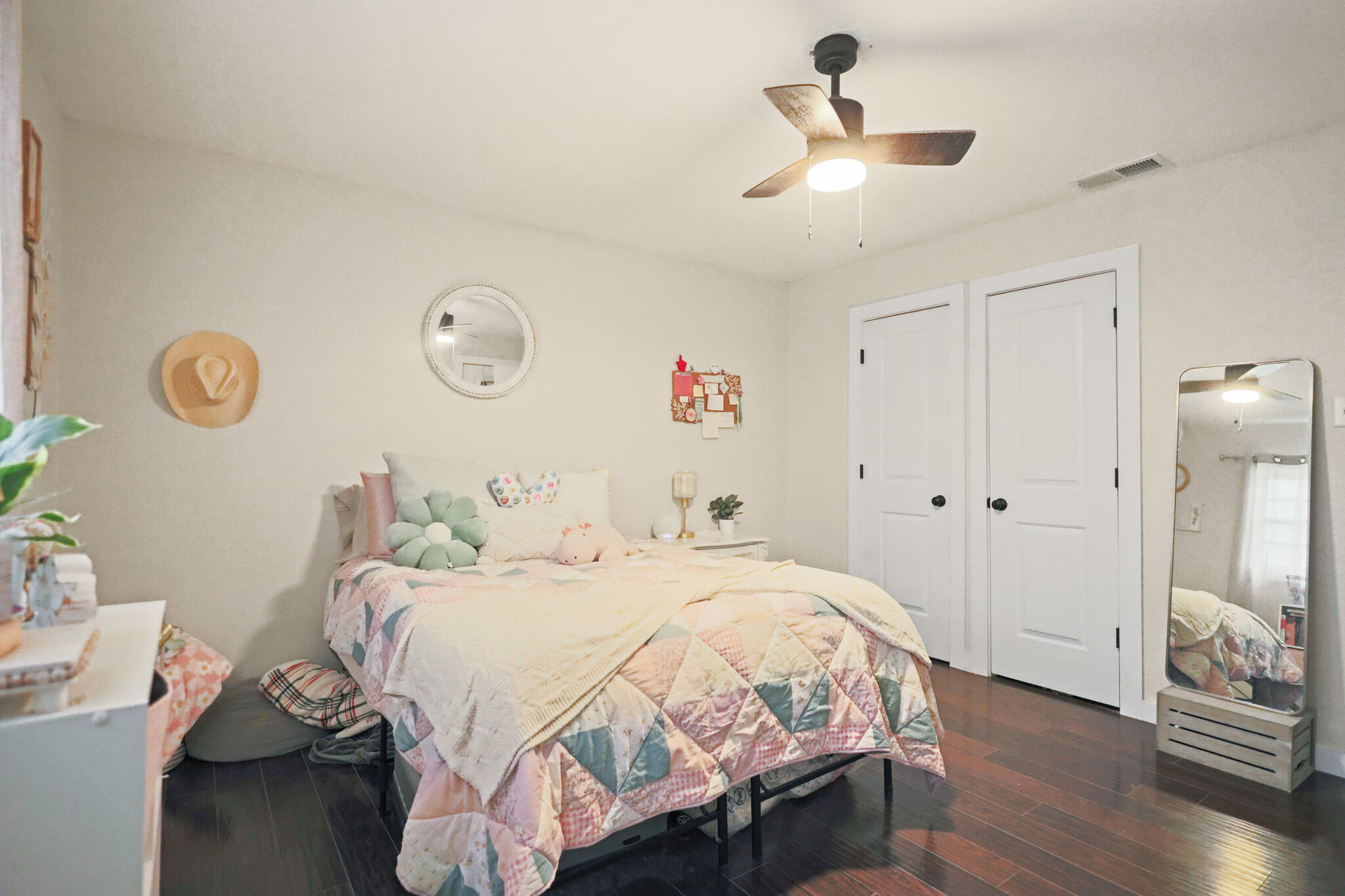4302 42nd Street Lubbock, TX 79413 - Photo 49 of 67 a bedroom with a bed and a chandelier
