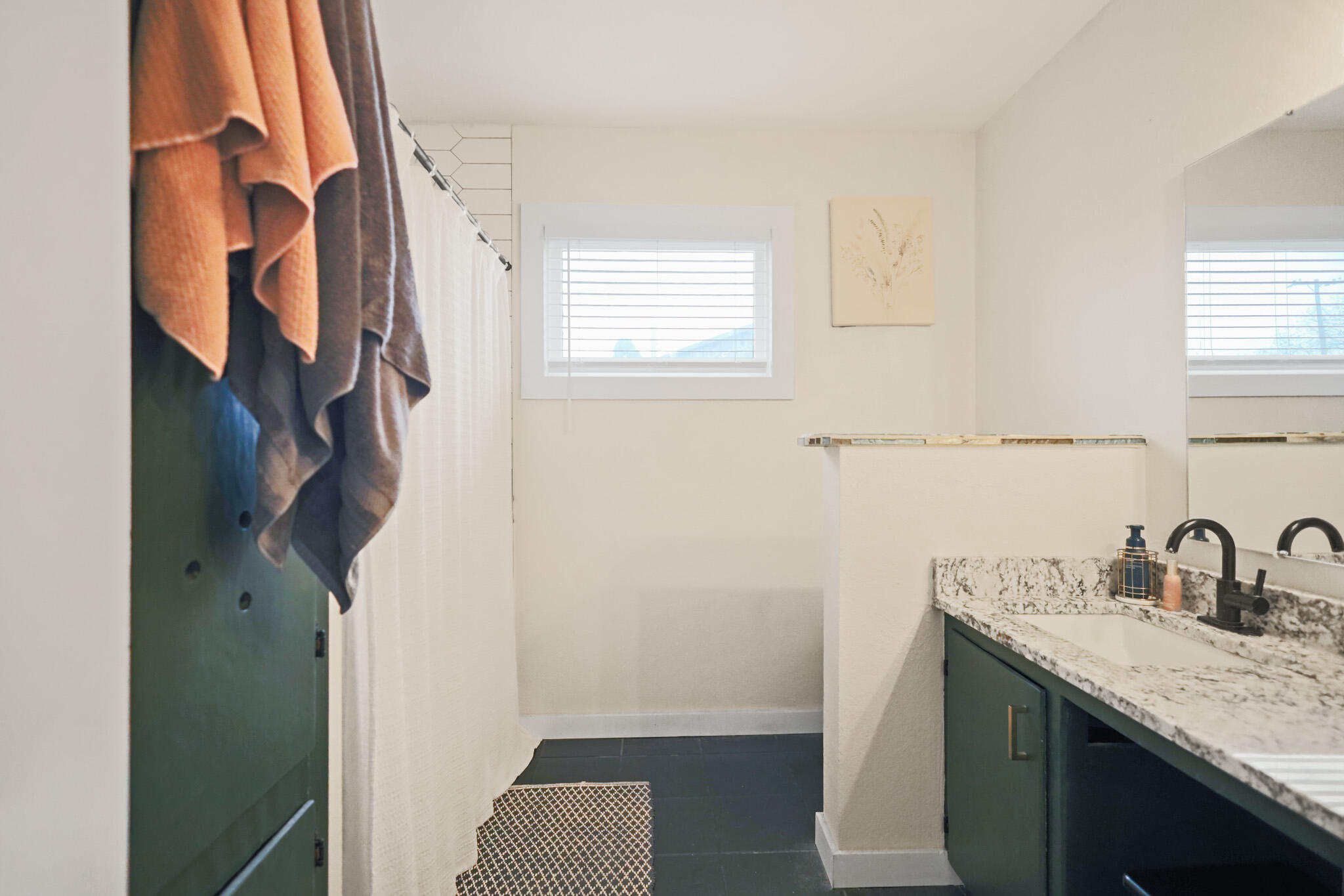4302 42nd Street Lubbock, TX 79413 - Photo 52 of 67 a bathroom with a granite countertop sink and a mirror