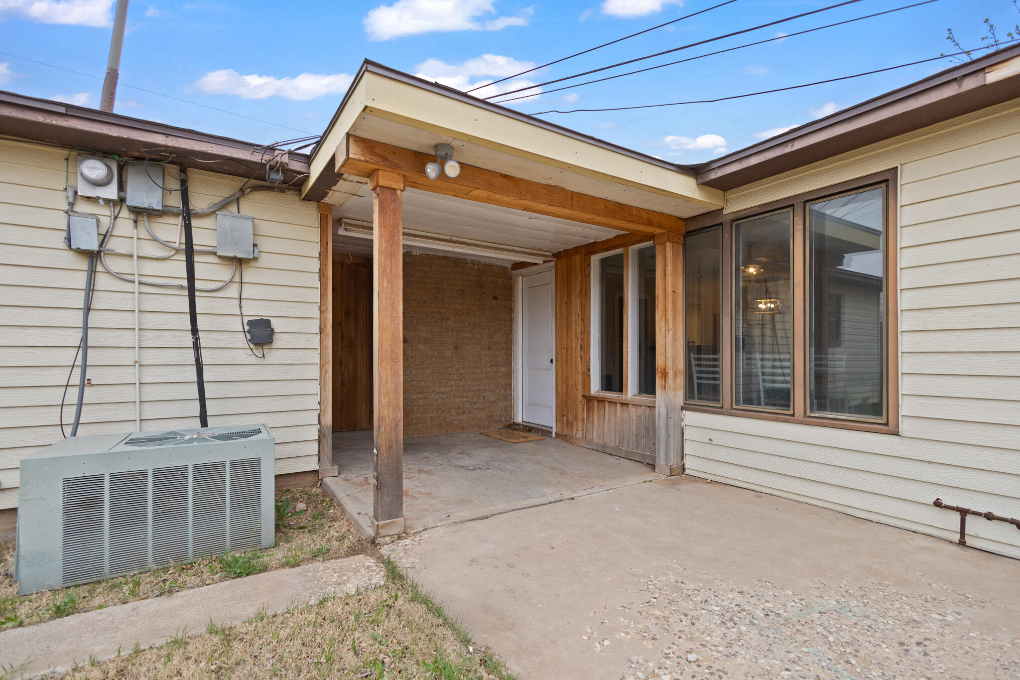 4302 42nd Street Lubbock, TX 79413 - Photo 58 of 67 a view of a porch with a door and wooden floor